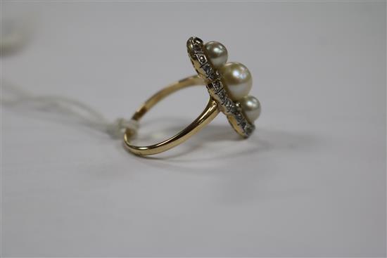 A yellow metal, cultured pearl and rose cut diamond triple cluster upfinger ring, size Q.